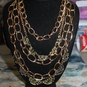 4 gold Tone chains & 2 Leopard chains Necklace
